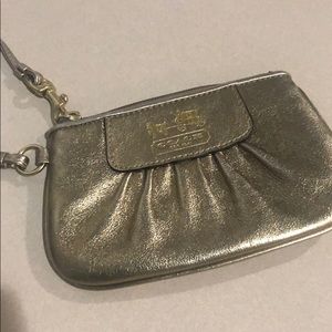 Small metallic gold Coach wristlet